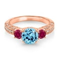 thumbnail image 2 of Gem Stone King 18K Rose Gold Plated Silver Swiss Blue Topaz Red Created Ruby and White Moissanite Engagement Ring for Women (2.23 Cttw, Gemstone November Birthstone, Round 7MM and 4MM, Size 6), 2 of 3