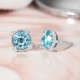 thumbnail image 2 of JeenMata Pendientes de Topacio Azul de Talla Redonda de 3,5 Quilates (Piedra Natal de Diciembre) con Halo Milgrain en Oro Blanco de 18 K sobre Plata, 2 of 6