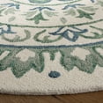 thumbnail image 3 of Safavieh Novelty 4' Round Hand Tufted Wool Rug in Ivory and Teal, 3 of 6