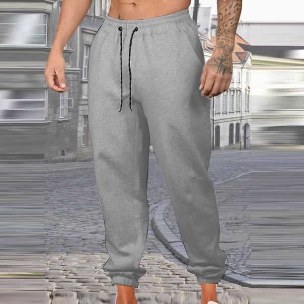 Pantalones largos para hombre, informales, a la moda, con bolsillos laterales, cintura elástica, color liso, de poliéster
