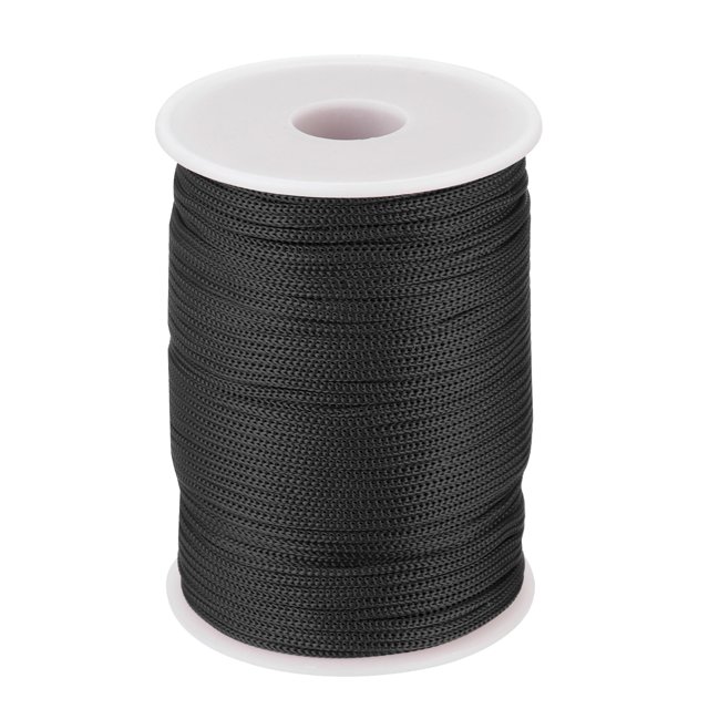 Unique Bargains 1/16 Inch Polypropylene Rope Braided Ropes, 328ft Nylon Rope for Clothesline, Camping, Outdoor, Black. A durable black braided polypropylene rope on a white spool, measuring 328ft in length and 1/16 inch in diameter. Suitable for camping cords, clotheslines, fishing, climbing, and DIY crafts, with strong and fade-resistant material ideal for Canadian outdoor conditions.