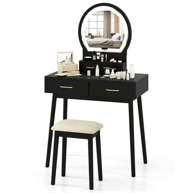 Gymax Small Vanity Desk with Mirror and Lights, featuring a black wood finish, cushioned stool, and LED lighted mirror with 3 adjustable lighting colors for makeup application. Includes ample storage with 2 desktop drawers, 2 large drawers, and an open shelf. Compact and modern design suitable for bedrooms or dressing areas.