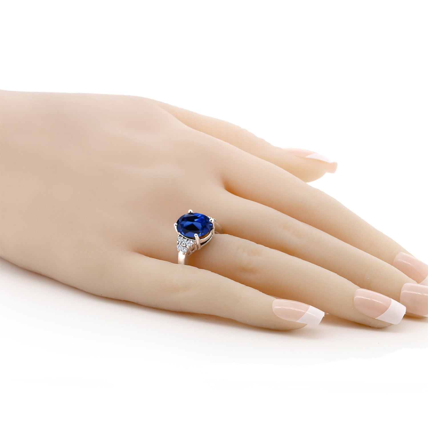 Gem Stone King 925 Sterling Silver Oval Blue Created Sapphire and White Moissanite Ring for Women (6.38 Cttw, Oval 12X10MM, Size 9)