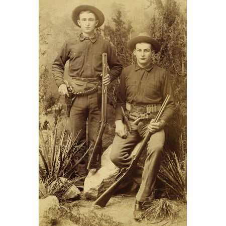 Two Young Cowboys Guns Bowie Knives Rifles Two Cowboys Have All The Accouterments For The Wild West  Over And Under Shotgun Bowie Knife Cartridge Belt With Six-Shooter Man On Right Winchester Bowie
