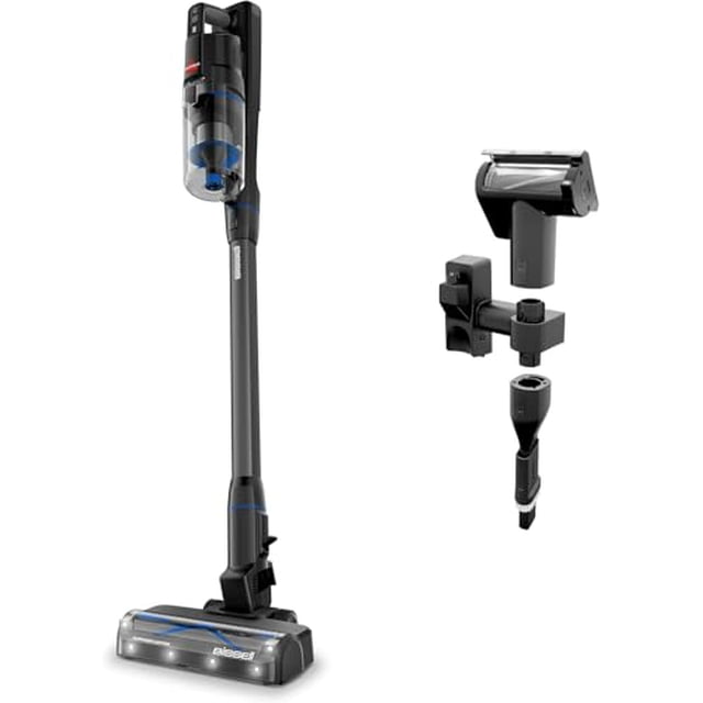 aspiradora inalámbrica autónoma bissell powerclean furguard de 280 w con rodillo de cepillo autolimpiable, potente succión, batería extraíble, soporte de pared, herramienta para tapicería y luces del — Vista frontal 3/4 de aspiradora de varilla BISSELL negra y gris con depósito transparente, tubo largo y cabezal motorizado con luces LED y rodillo autolimpiable; a la derecha, accesorios mostrados: herramienta para tapicería FurFinder, boquilla estrecha y soporte de pared; diseñada para eliminar pelo de mascota y residuos en tapicerías e interiores de auto.