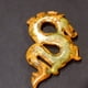thumbnail image 3 of Antique-style jade carvings, including vintage jade dragons, phoenixes, axes, and weapons, made of Xiuyan jade., 3 of 4