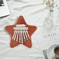 thumbnail image 1 of Xihbxyly Mini Piano de Pulgar, Diseño de Madera Maciza de 8 Tonos, Piano de Dedo Fácil de Tocar, Ligero y Portátil, con Cordón para Facilitar Su Transporte, Instrumento Musical para Todas Las Edades,, 1 of 7