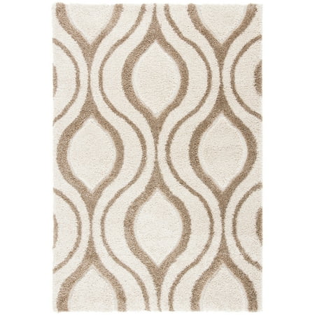 Safavieh SAFAVIEH Florida Shag SG461-1213 Ivory / Beige Rug SAFAVIEH Florida Shag SG461-1213 Ivory / Beige Rug Inspired by the influential Miami art scene  this geometric patterned Florida shag by SAFAVIEH is truly a decorative display for home d�cor. Concentric hourglass designs stretch across this plush shag rug to bring  70s era flair to both modern and transitional d�cor. Constructed using machine-woven cut and looped synthetic yarns for flowing dimension and rich textural appeal. Rug has an approximate thickness of 1.2 inches. For over 100 years  SAFAVIEH has set the standard for finely crafted rugs and home furnishings. From coveted fresh and trendy designs to timeless heirloom-quality pieces  expressing your unique personal style has never been easier. Begin your rug  furniture  lighting  outdoor  and home decor search and discover over 100 000 SAFAVIEH products today.