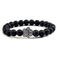 thumbnail image 1 of Pulsera con dije de huella de pata de piedra volcánica de lava negra mate natural, ideal como recuerdo para mascotas, amantes de los gatos y los perros., 1 of 2