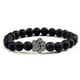thumbnail image 1 of Pulsera con dije de huella de pata de piedra volcánica de lava negra mate natural, ideal como recuerdo para mascotas, amantes de los gatos y los perros., 1 of 2