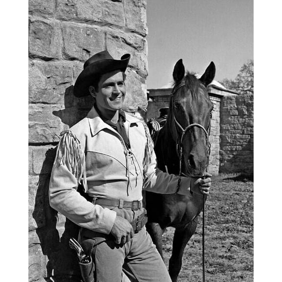 Clint Walker in fringed western jacket holding horse as Cheyenne 24x36 Poster