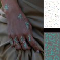 thumbnail image 5 of Blue Luminous Tattoo Sticker , Constellation Deer Feather Butterfly Snake Pattern, Waterproof Temporary Tattoo Finger Wrist Body Art For Women And Kids, 5 of 5