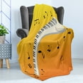 thumbnail image 4 of Music Note Soft Flannel Fleece Throw Blanket, Joy in the Air as the Sunsets Piano Keys Floating, Cozy Plush for Indoor and Outdoor Use, 70" x 90", Yellow Orange, by Ambesonne, 4 of 5