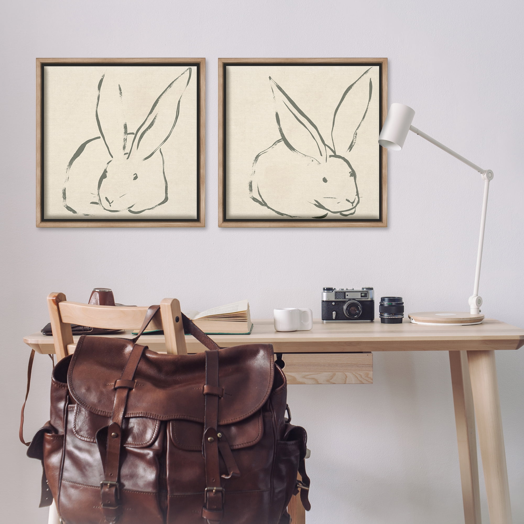 Stupell Industries Minimalist Resting Rabbit Line Drawing Animals Drawing Brown Floater Framed Canvas Art Print Wall Art, 25 x 25, Set of 2