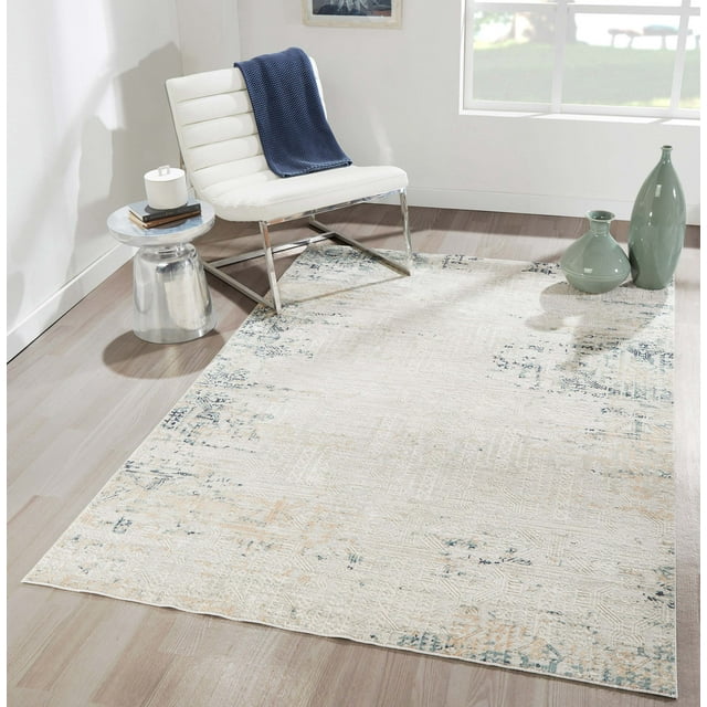 ECARPET Amber traditional area rug featuring subtle amber and blue distressed designs, displayed in a bright living room with white chair, side table, and decorative vases.