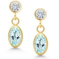 thumbnail image 2 of Gem Stone King 14K Yellow Gold Sky Blue Topaz and White Moissanite Drop Dangle Earrings for Women (1.20 Cttw, Gemstone Birthstone, Oval 6X4MM, Round 3MM), 2 of 4