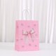 thumbnail image 3 of Bolsas de papel kraft con lazo rosa para fiestas, 24 unidades, 21 x 15 x 8 cm, 3 of 3