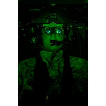 - Pilot equipped with night vision goggles in the cockpit of an Apache helicopter Poster Print by Terry MooreStocktrek Images