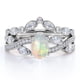 thumbnail image 1 of JeenMata Anillo de Bodas con Bisel en Forma de Chevron, Pavé Infinito de Canal de Moissanita y Ópalo Welo Ovalado de 1,75 Quilates, Engastado en Oro Blanco de 18 K sobre Plata, 1 of 6