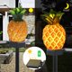 thumbnail image 2 of Luces solares de estaca para decoración de jardín, paquete de 2 luces impermeables de piña para exteriores, decoración de pasarela de césped y patio, 2 of 5