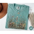 thumbnail image 4 of Skeleton Dancing Arabesque Wildflower T-Shirt | Cottagecore Botanical Floral Skeleton Graphic Tee in Moss Green | Nature Lover Women's Shirt, 4 of 5