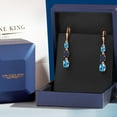 thumbnail image 5 of Gem Stone King 18K Rose Gold Plated Silver Swiss Blue Topaz 3 Stone Dangle Earrings for Women (6.10 Cttw, Gemstone November Birthstone, Oval 8X6MM, 7X5MM and 6X4MM), 5 of 6