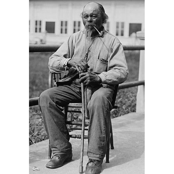 Portrait of an Male Ex-Slave Sitting in Chair & Smoking-Fine art canvas print (20" x 30")