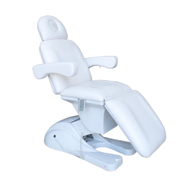 camilla eléctrica para masaje vanlig blanca, vista 3/4 lateral frontal; sillón acolchado en poliuretano blanco con reposacabezas ovalado, apoyabrazos, sección de piernas ajustable y base motorizada con control por cable; inclinación 180°–90°, soporta 180 kg. Llega en dos paquetes; vendedor dará el segundo número de guía. Ideal también para tratamientos estéticos.