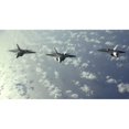 thumbnail image 2 of A three-ship formation of F-22 Raptors fly over the Pacific Ocean Poster Print, 2 of 2