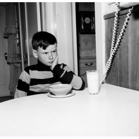 24' Bowl Shade Boy frowning over bowl of cornflakes and glass of milk Stretched Canvas - (18 x 24) ()