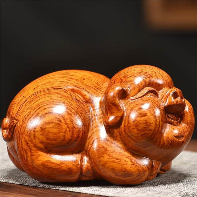 Rosewood carved pig figurine, a zodiac pig auspicious symbol for home living room feng shui, corner decoration craft.