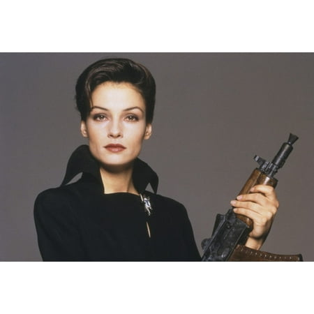 - Famke Janssen in GoldenEye studio pose in black outfit holding machine gun 24x36 Poster
