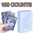 thumbnail image 1 of Fundas para tarjetas de Pokemon, 100 cuentas, juegos de juego transparentes, carpeta protectora de tarjetas VMAX, funda protectora de Pokémon Yugioh, juguete para regalo para niños Tan Jianjun unisex, 1 of 2