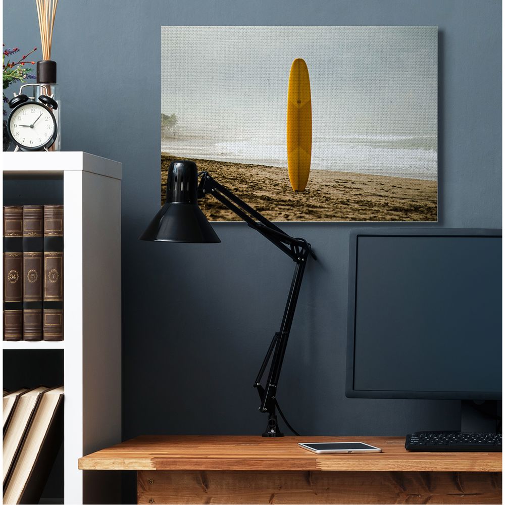 Stupell Industries Yellow Surfboard in Sand Near Shore Photograph Designed by Unsplash