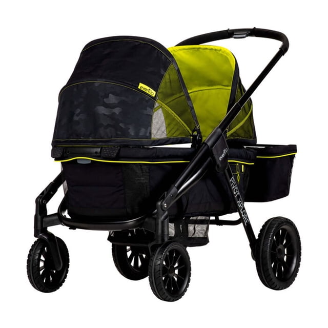 evenflo pivot xplore all-terrain stroller wagon (wayfarer black) cochecito todoterreno convertible en carreola, vista 3/4 trasera que muestra chasis y manillar negros, toldos interiores verde lima, asiento para 1–2 niños hasta 5 años, ruedas grandes todo terreno y cesta de almacenamiento inferior.