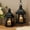 Black, variant on JHY DESIGN Brushed Metal Hollow Home Pillar Candles Candle Lantern, Set of 3