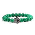 thumbnail image 1 of Pulsera con dije de huella de pata de piedra volcánica de lava negra mate natural, ideal como recuerdo para mascotas, amantes de los gatos y los perros., 1 of 2
