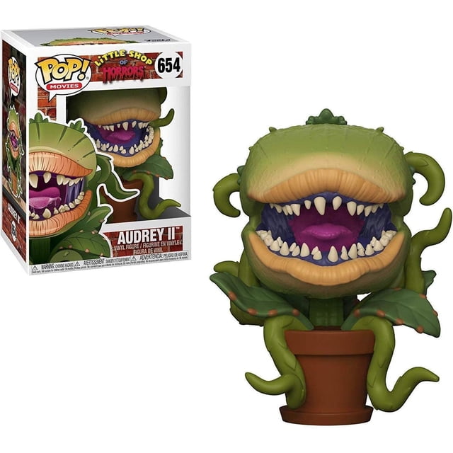 funko pop movies: little shop of horrors - audrey ii (styles) figura Funko POP! multicolor, vista frontal 3/4 de la planta Audrey II en maceta; cabeza verde con labios anaranjados, boca abierta con lengua morada y dientes blancos, hojas y tentáculos verdes visibles, caja con ventana al fondo. También suele usarse como figura de exhibición para colecciones pequeñas.