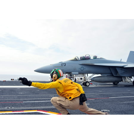 Canvas Print Lt. Laurie Canter signals off an F/A-18F Super Hornet assigned to the Bounty Hunters of Strike Fight Stretched Canvas 10 x