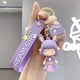 thumbnail image 2 of Llavero lindo de PVC para damas y niñas, regalo 3d para mochilas de mujer, llavero de metal colgante para decoración de llaves de autos, incluye una bolsa de regalo, púrpura Feliz Sencillez, 2 of 5