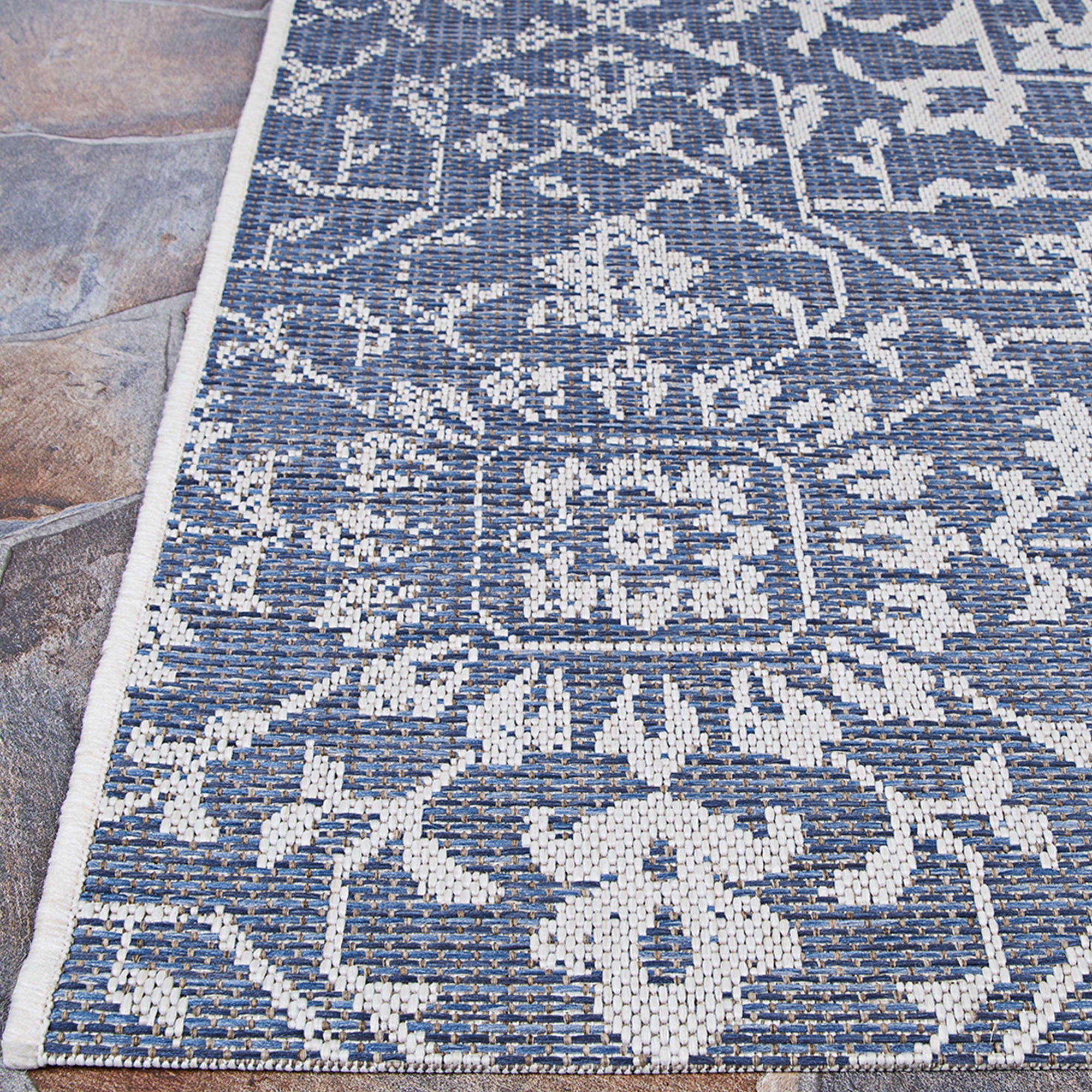 Couristan 5.5' x 9' Ocean Blue and Ivory Outdoor Floral Rectangular Area Throw Rug