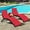Red, variant on Costway Folding Patio Rattan Lounge Chair Chaise Cushioned Portable Garden Lawn Black