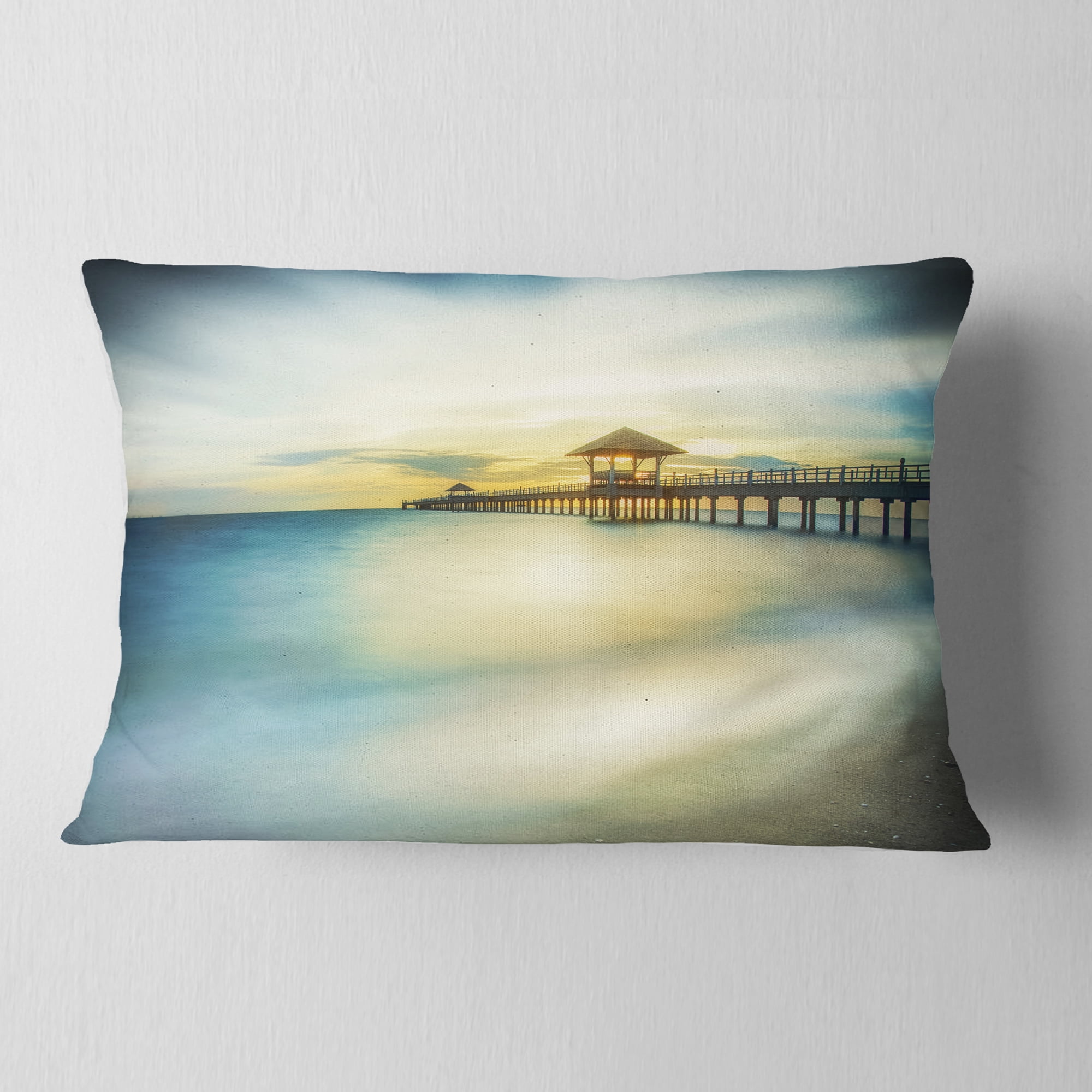 Designart Blue Tinged Seashore with Distant Pier - Pier Seascape Throw Pillow - 12x20