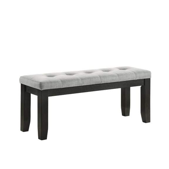 Gray upholstered tufted bench - in dining room, complements the table