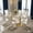 Table+6 White Chairs, variant on Hi loPres 9-Piece Dining Set, 71" Tempered Glass Table with Gold Metal Pedestal Base and 8 Black PU Leather Chairs with Gold Legs for Dining Room