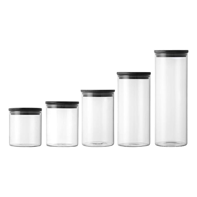 5Pcs Glass Storage Jar Food Storage Canisters Seasoning Tank Transparent Container jars kitchen Canister for candy Counter. A set of five transparent high borosilicate glass jars with black airtight bamboo lids, arranged in ascending size order. Perfect for storing grains, snacks, tea, coffee beans, or candy, and ideal for counter organizers or home decoration.