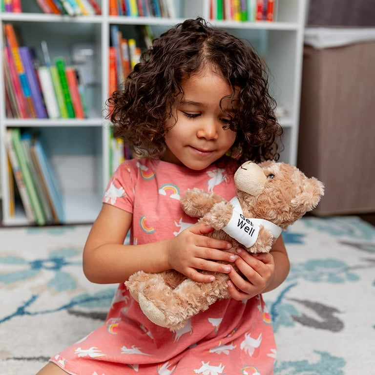 Cute little girl with broken arm in the gypsum with teddy bear