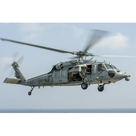 An MH-60S Sea Hawk Helicopter from the Red Lions of Helicopter Sea Combat Squadron (HSC) 15 flies pl Poster Print 24 x 36