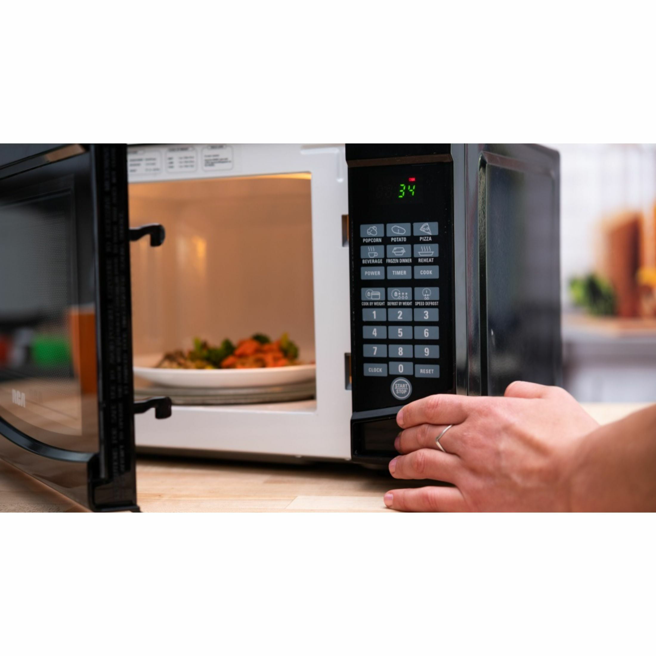 RCA 0.7 Cu. ft. Countertop Microwave in White
