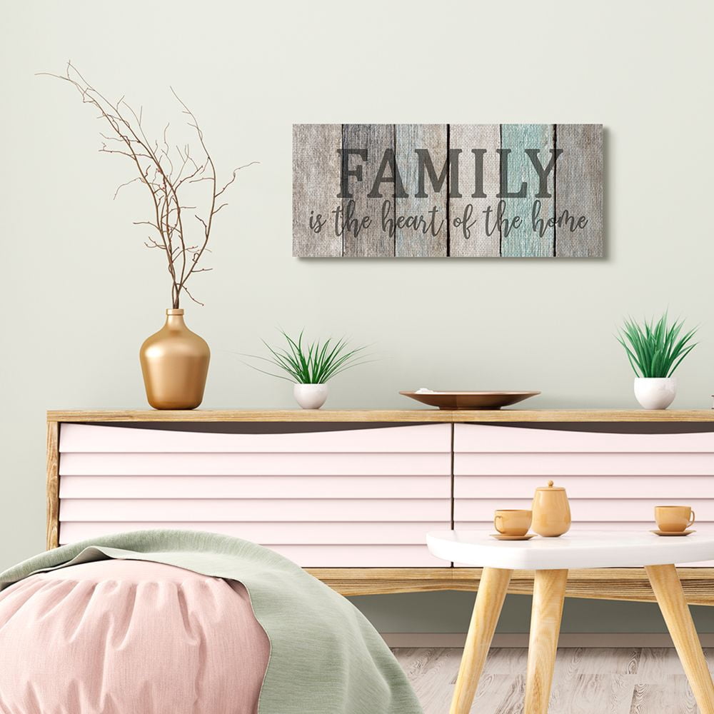 Stupell Industries Family is the Heart of Home Quote Weathered Wood Grain Canvas Wall Art Design by Kim Allen, 13" x 30"